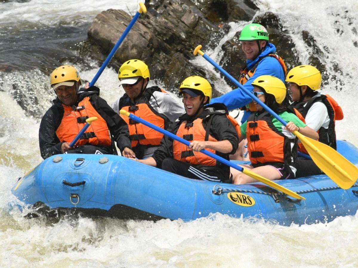 a group of people on a raft in the snow